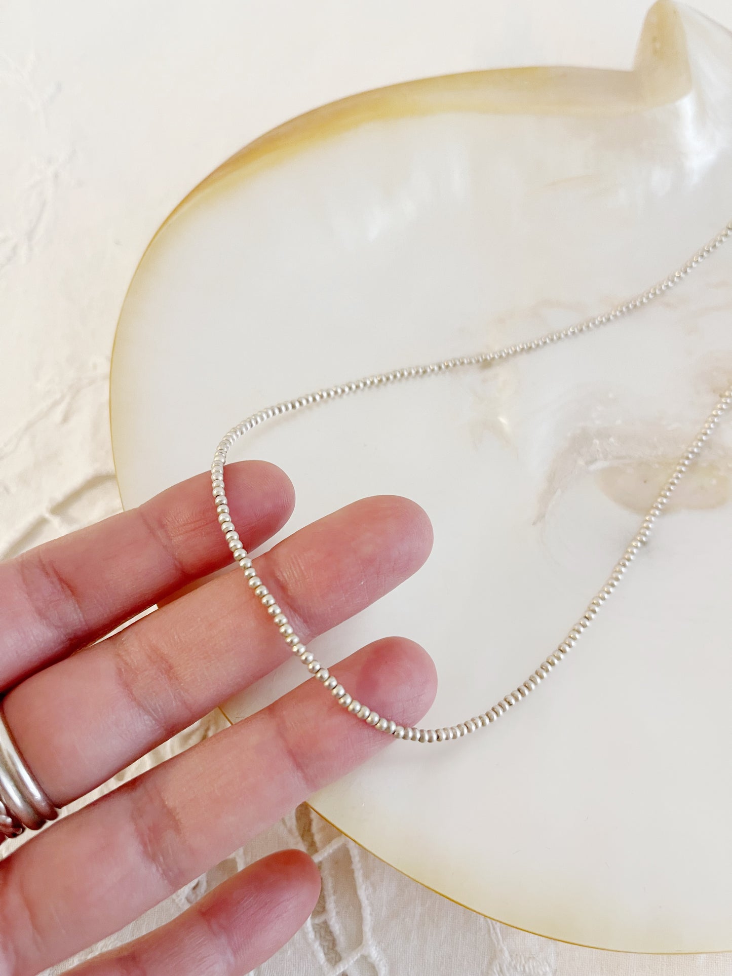 Navajo Shiny Micro Pearl Necklace 2mm 20 inc.